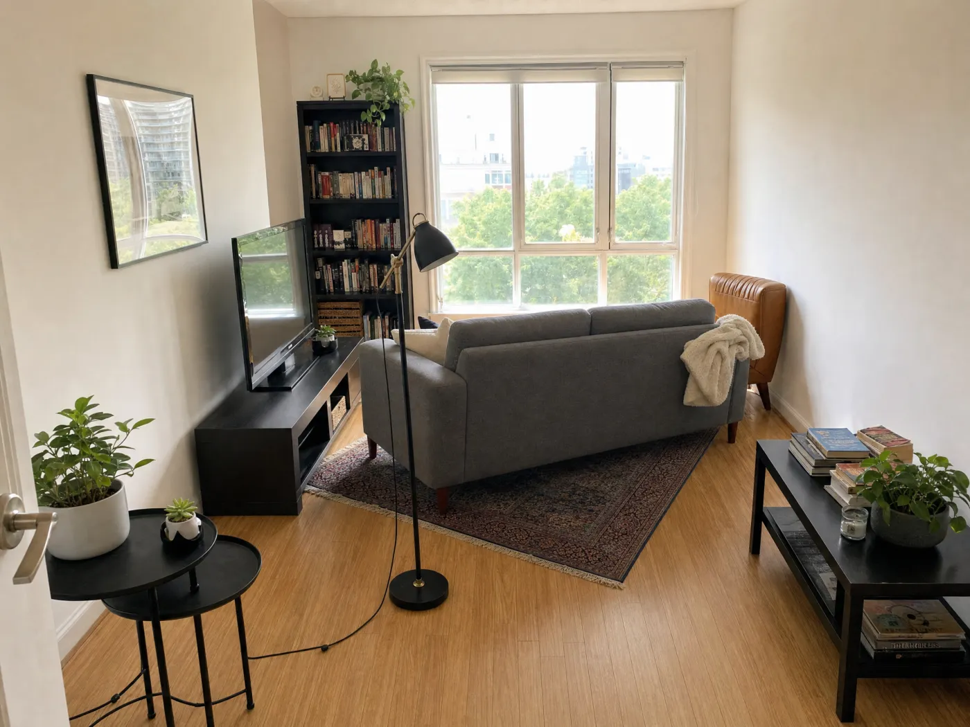 Living room with awkward furniture arrangement, sofa blocking the window