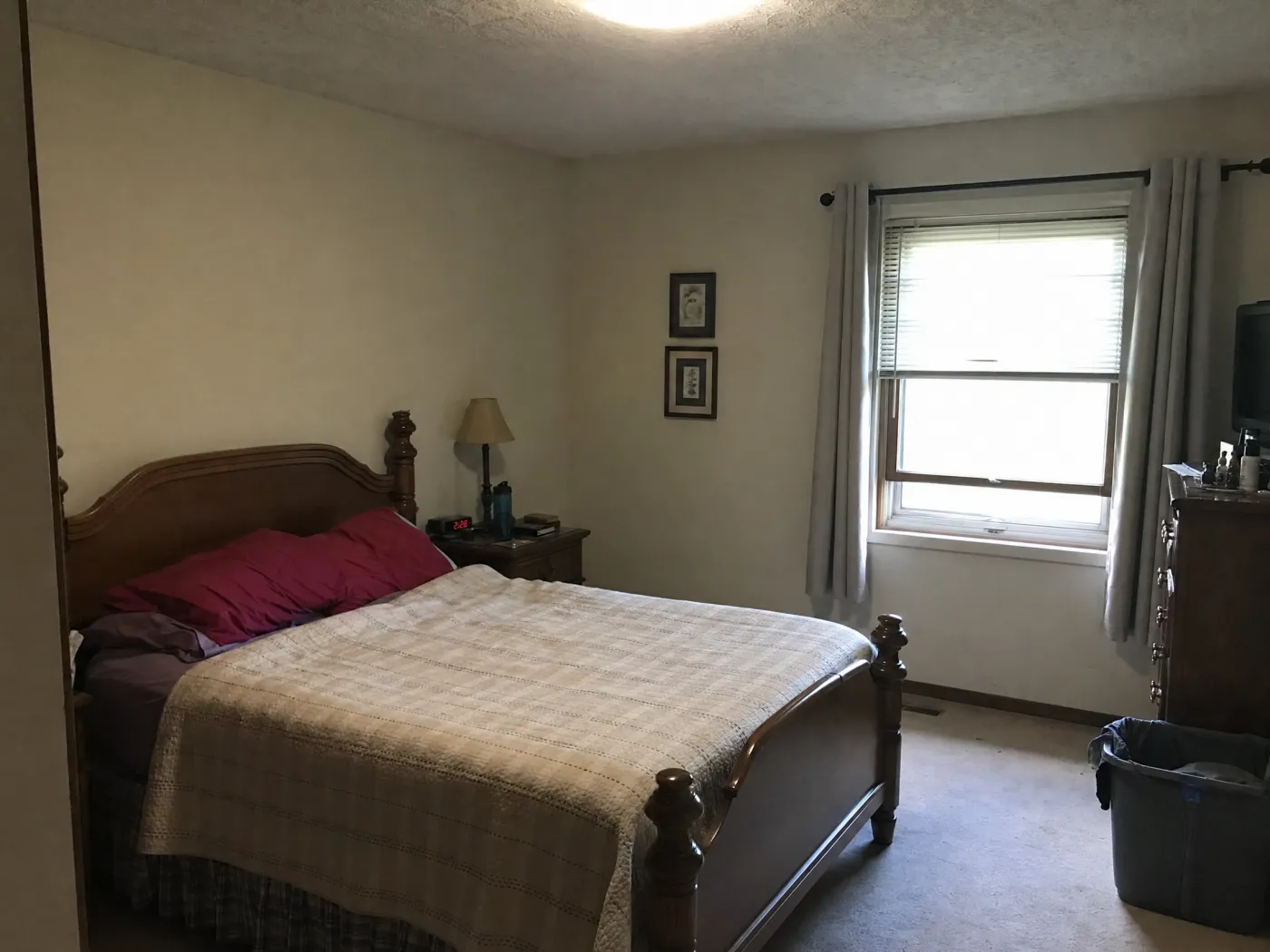 Plain, dated bedroom before redesign